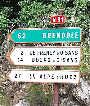 Intersection D213-N91 - Roadsigns towards Alpe d'Huez - 27 km