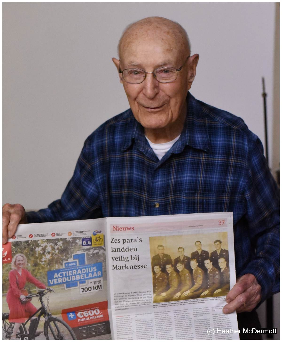 Everett (98) with newspaper