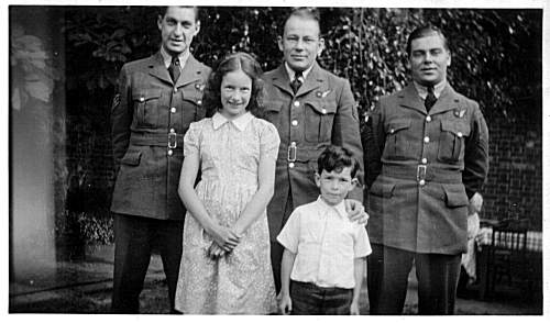 Ed Crothers (left), with unknown Airmates and children