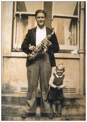 Jack posing with saxophone - child unknown